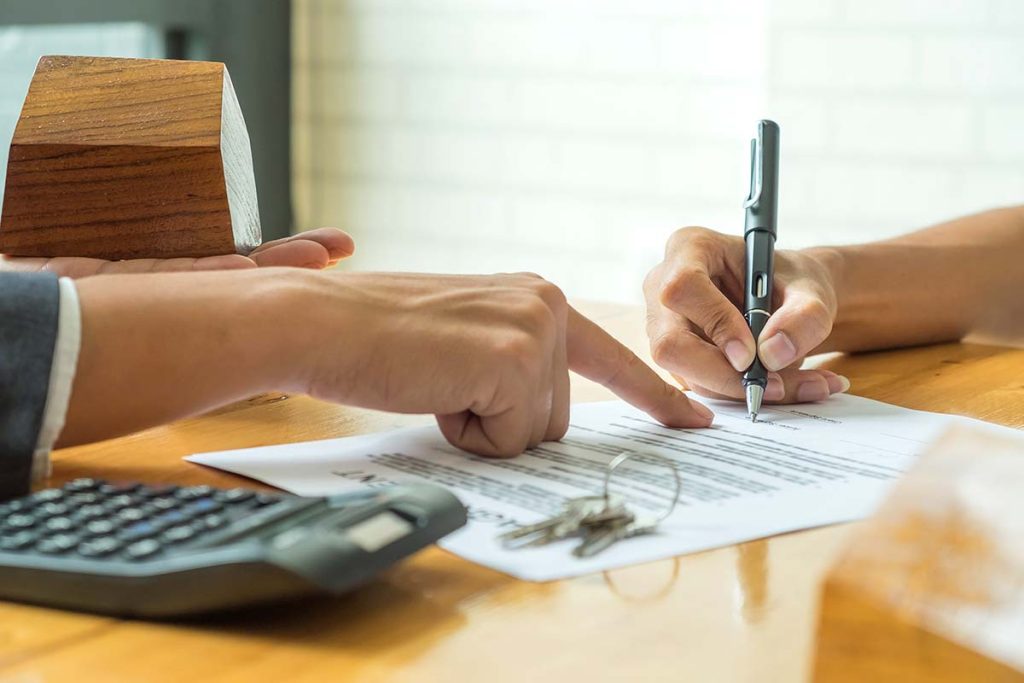 tenant and landlord signing a lease agreement